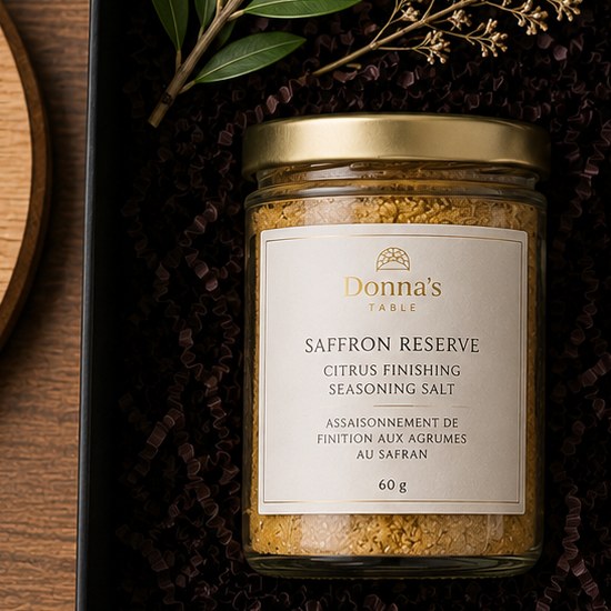 Saffron Reserve citrus finishing seasoning salt in a glass jar with a gold lid.